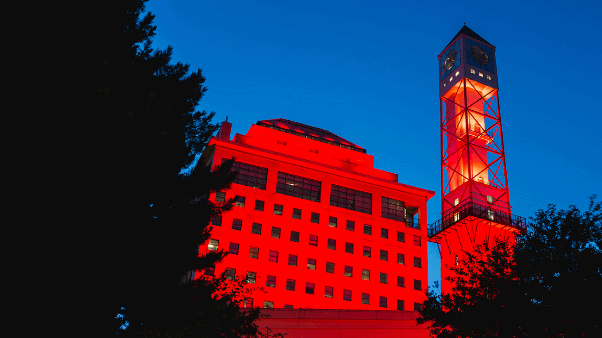 The Civic Centre clock tower lit red and blue.